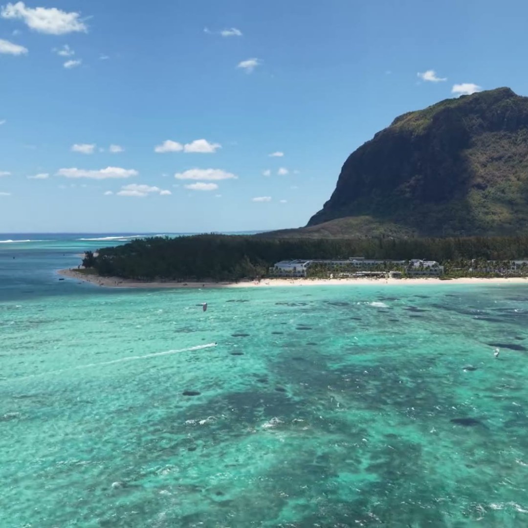 Aerial view of Le Morne lagoon with kites on the turquoise water