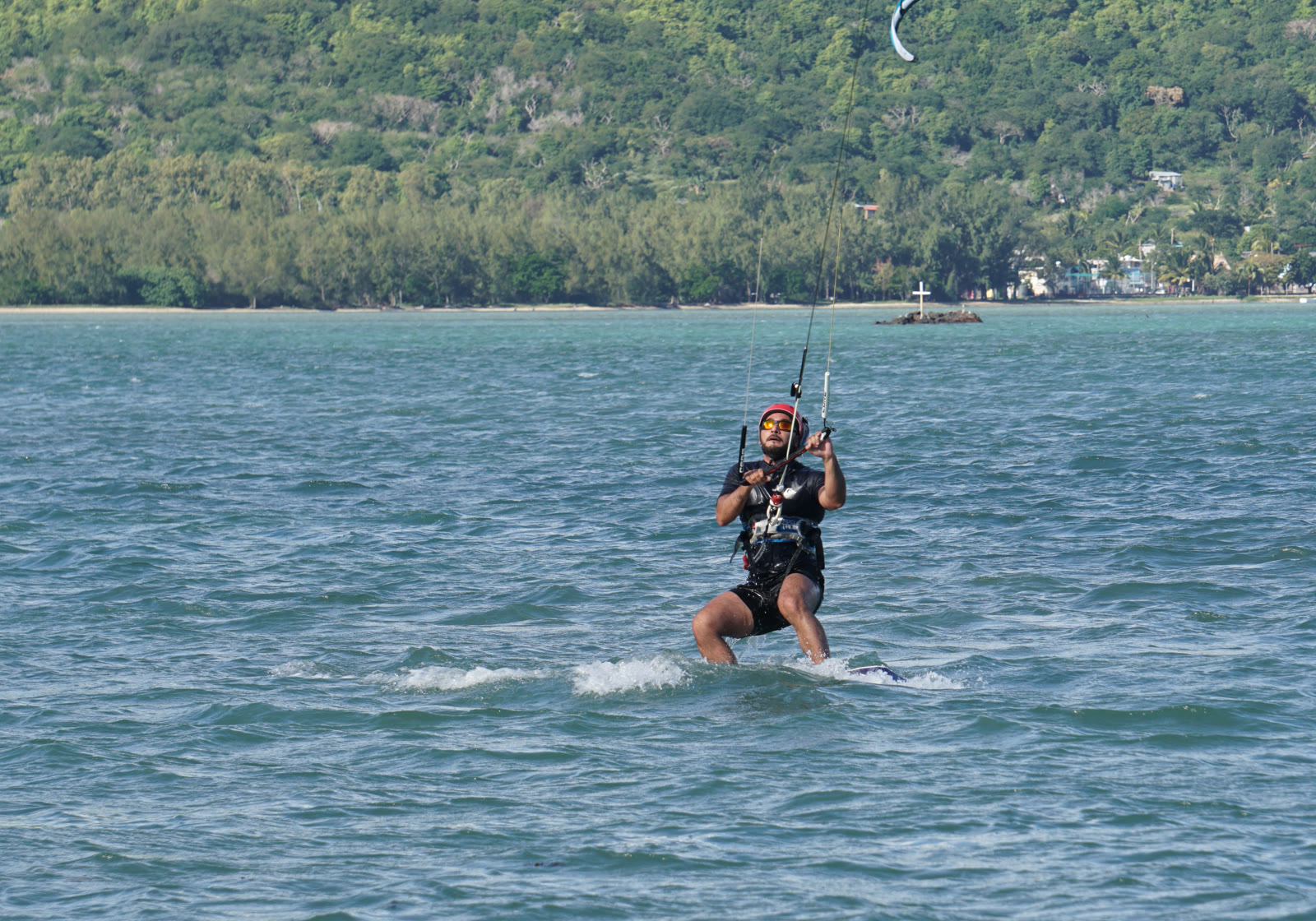 Kitesurfer riding at Manawa with Le Morne mountain behind