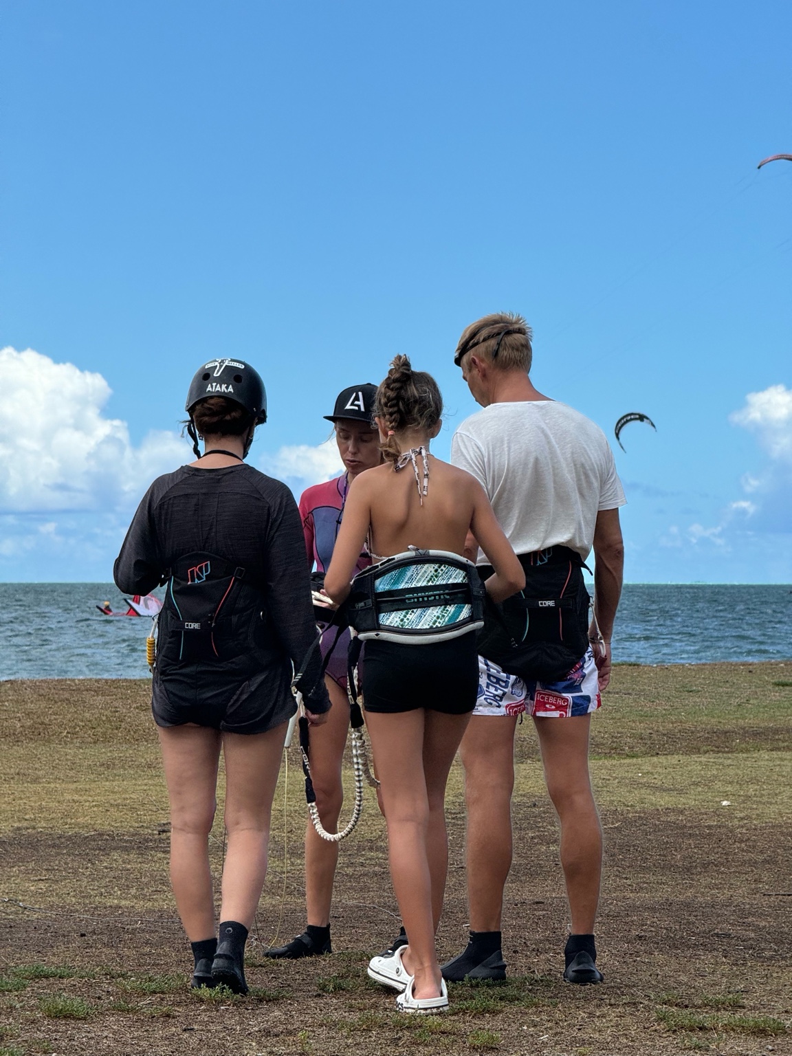 Kitesurfer carving the turquoise lagoon