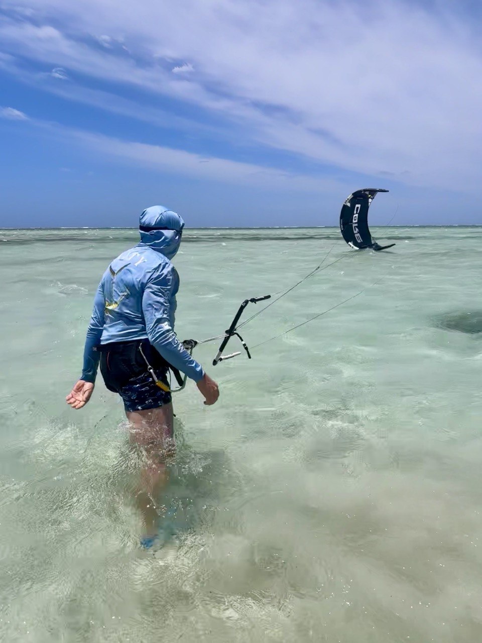 Private lesson in transparent shallow water on the sandbank